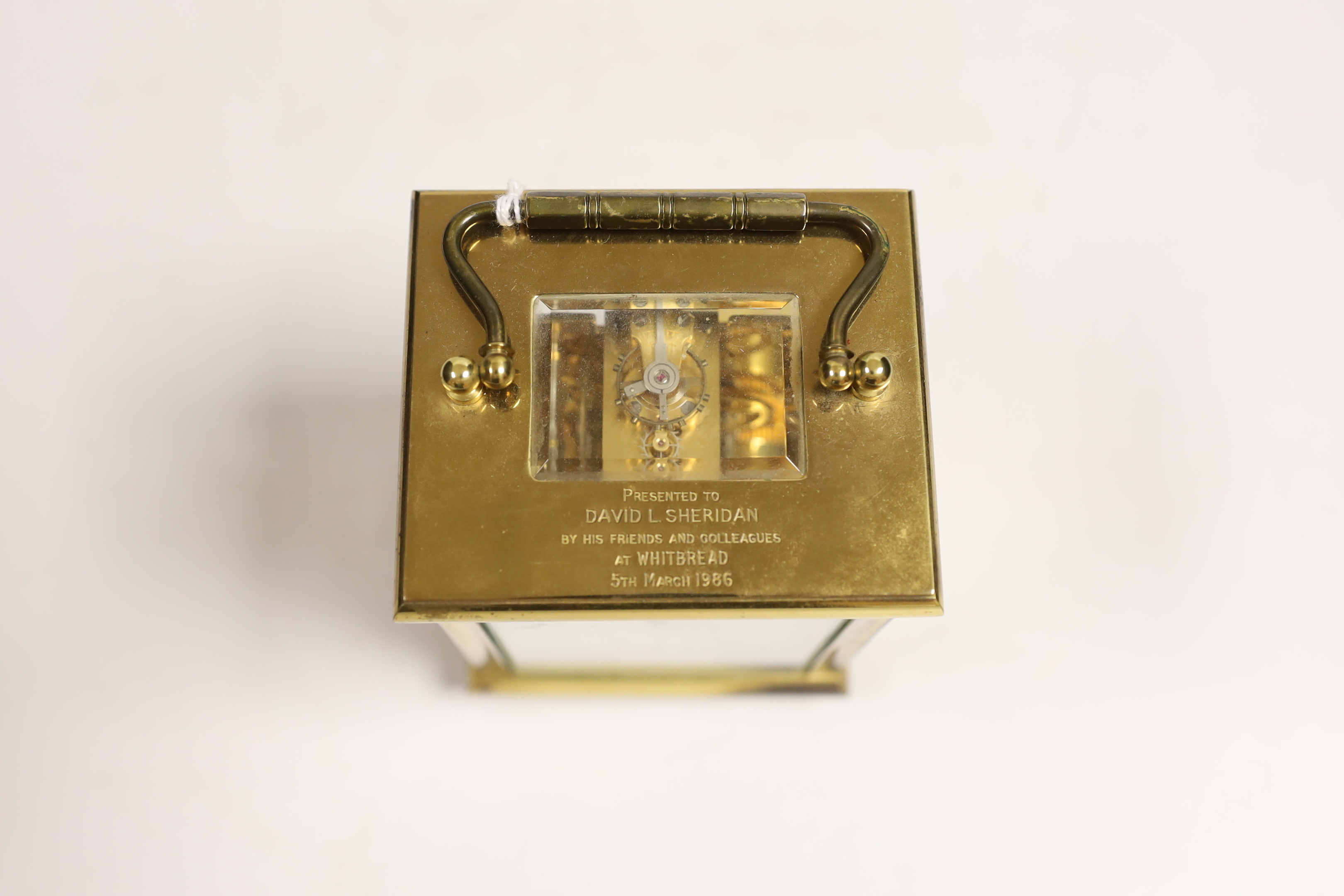 A 20th century brass carriage clock, signed Taylor and Bligh, England, striking on a bell 14cm high
